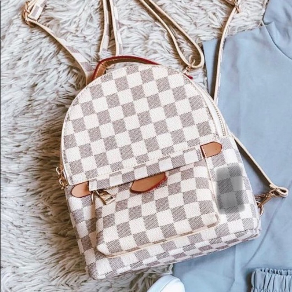 NWOT. Designer inspired backpack/crossbody purse.